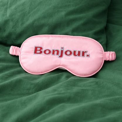 Masque pour les yeux coloré rose et rouge avec message "BONJOUR"