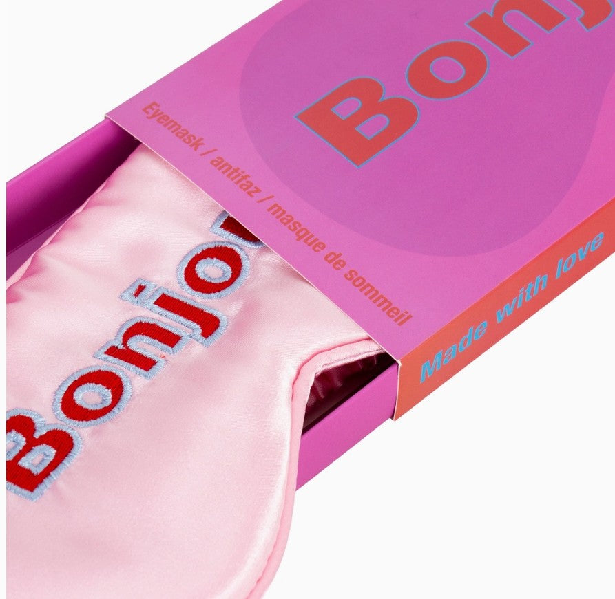 Zoom sur packaging masque pour les yeux coloré rose et rouge