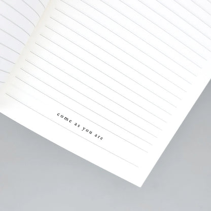 Phrase positive inscrite à l'intérieur du carnet