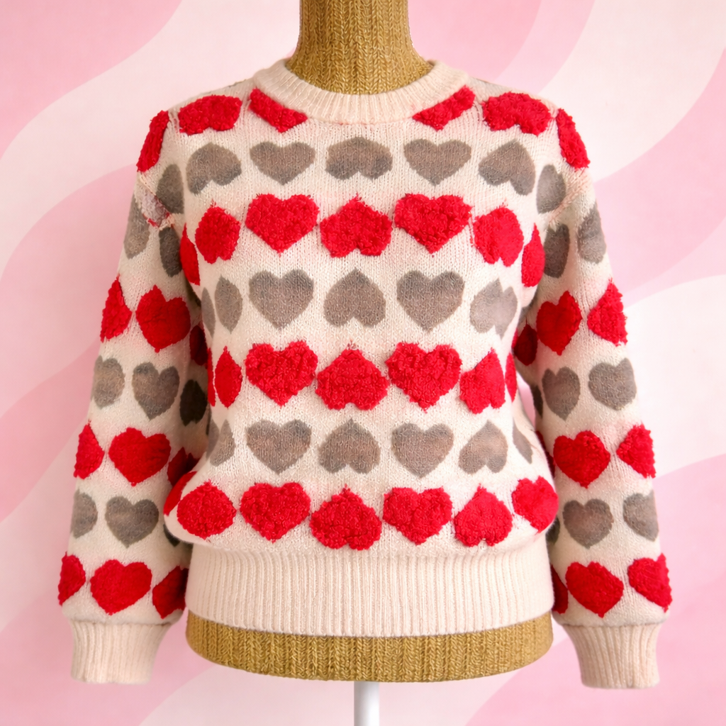 pull cœur rose kaki sur fond coloré