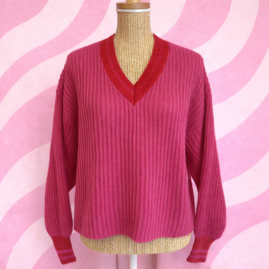 pull made in Italie rose et rouge porté sur un buste